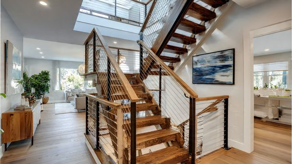 15 Stair Railing Ideas: Stylish, Modern & Creative Designs for Your Home 6 Cable Stair Railing for a Sleek Modern Look